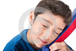 Little boy sleeping on pillow on white background