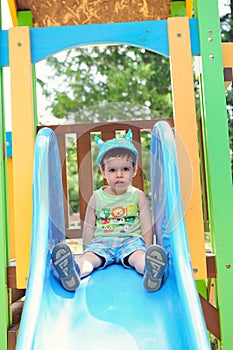 Little boy on a slide