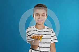 Little boy with slime on blue