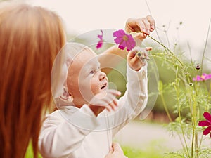 Little Boy Smelling Flower