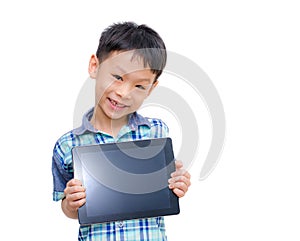 Little boy smiles with tablet computer