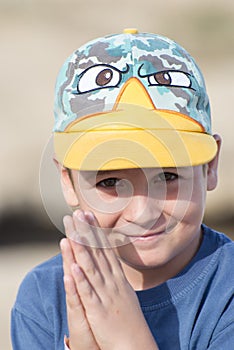 Little boy smiling and begging