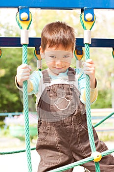 A little boy smiling and playing