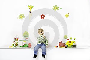 Little boy in spring arrangement photo