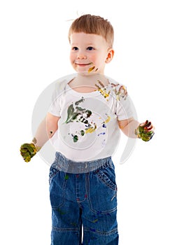 Little boy stained in paint
