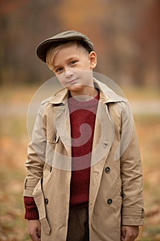 Little boy standing in a coat