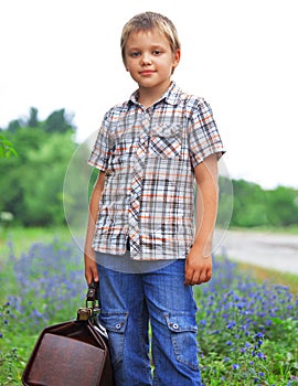 Little boy standing about road