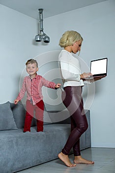 Little boy steals money from mom pocket.