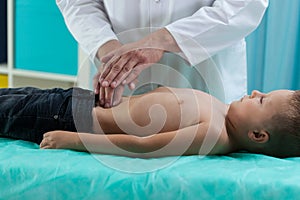 Little boy during stomach examination