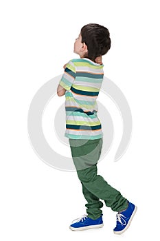 Little boy in a striped shirt looks back