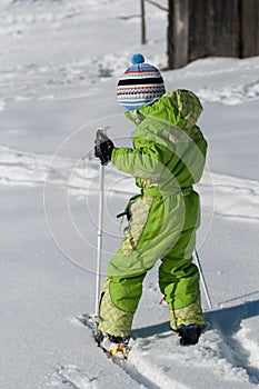 Little boy studiing skiing