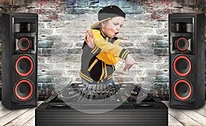 The little boy in the style of Hip-Hop .Cool rap dj. Children`s fashion.Cap and jacket. The Young Rapper.