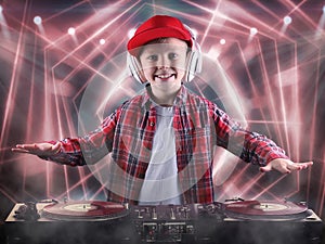 The little boy in the style of Hip-Hop .Cool rap dj. Children`s fashion.Cap and jacket. The Young Rapper.