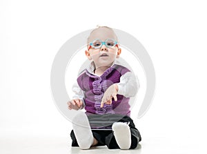 A little boy in a suit and glasses photo