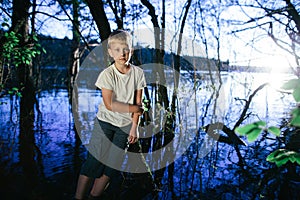 Little boy on swamp