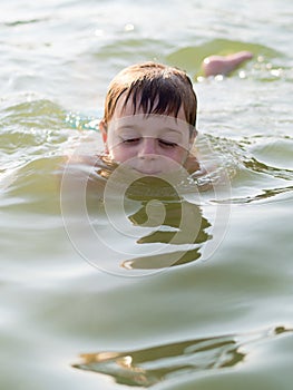 Little boy swimming