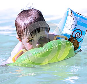 Little boy in swimming pool