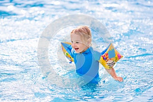 Little boy in swimming pool