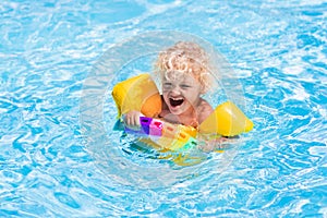 Little boy in swimming pool