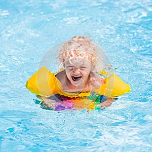 Little boy in swimming pool