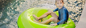 Little boy swimming with rubber ring at the leisure center BANNER, LONG FORMAT