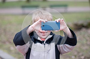 Little boy taking photos