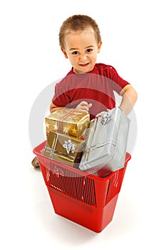 Little boy throwing presents in garbage bin