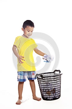 Little boy throwing waste paper