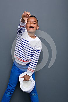 Little boy with thumbs down gesture