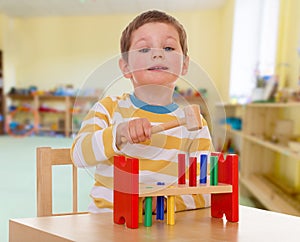 Little boy to school in the Montessori