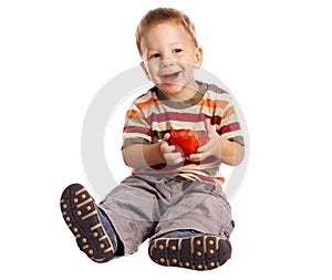 Little boy with tomato