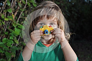 Little boy with toy camera