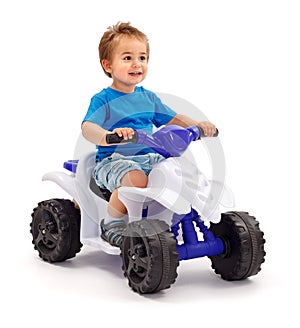 Little boy on toy car