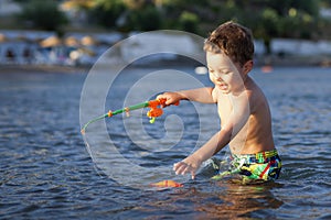 Little boy and toy fishing pole