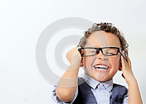 Little boy trying a pair of glasses on