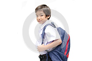 Little boy in uniform ready for school isolated