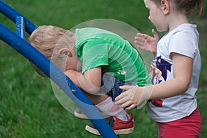 The little boy is upset. He failed on the projectile.