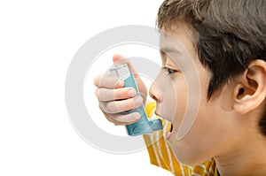 Little boy using Asthma inhaler for breathing