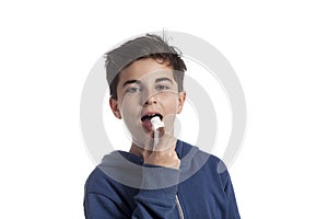 Little boy using asthma inhaler