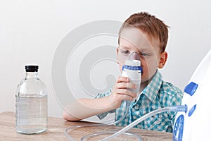 Little boy using bronchitis inhaler. Concept healthcare of children