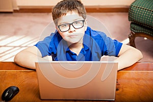 Little boy using a laptop