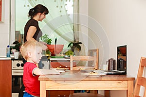 Little boy using laptop computer playing games