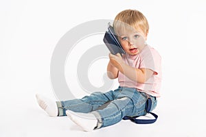 Little boy using mobile phone. Child playing on smartphone. Technology, mobile apps, children and parental advisory