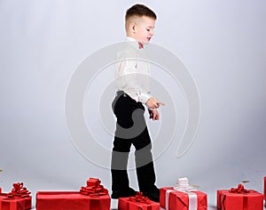 Little boy with valentines day gift. tuxedo style. Happy childhood. Birthday party. happy child with present box