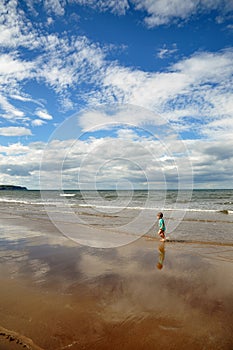 Little boy walking on the beach