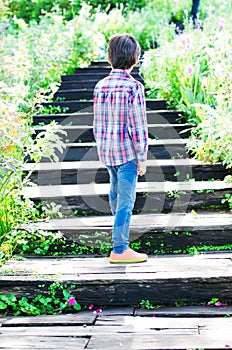 Little boy walking on Stairs going uphill