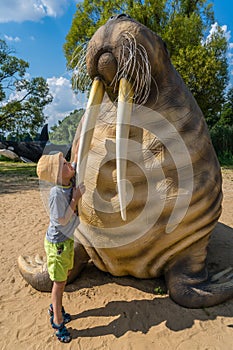 Little boy and walrus statue