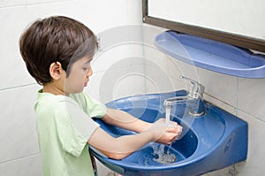 Little boy washing hand