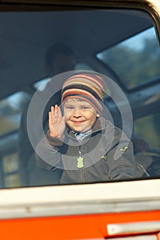 Little boy waving hand