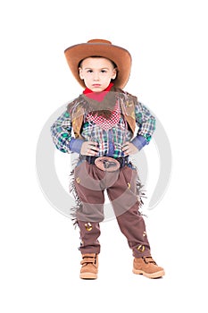 Little boy wearing cowboy suit